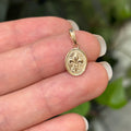 14K Yellow Gold Fleur de Lis Oval Tectuxed Design Detailed Charm Pendant