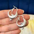 Sterling Silver Polished Playful Dolphin Round Hoop Earrings
